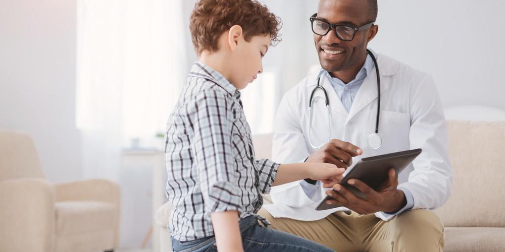 African American doctor with child